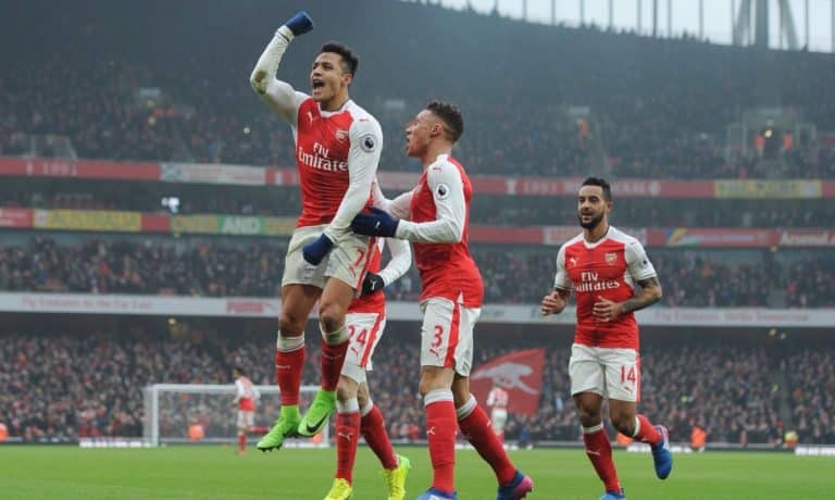 Alexis Sanchez celebrates after bagging a brace against Hull City