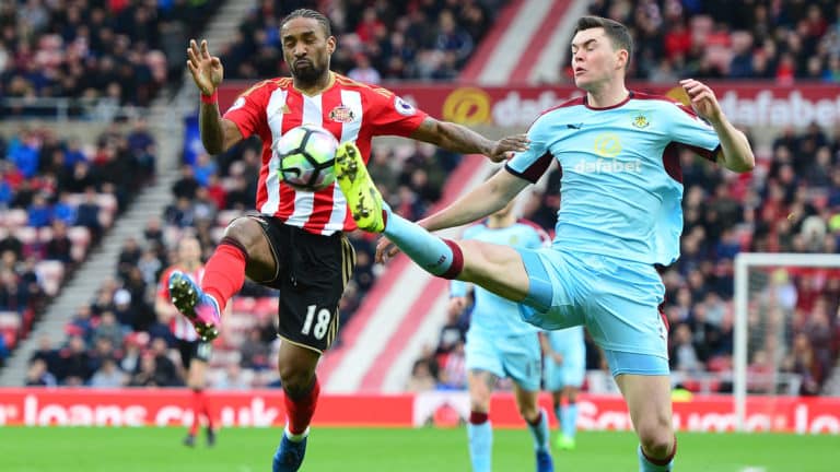 Michael Keane and Jermain Defoe battle for the ball as Sunderland host Burnley