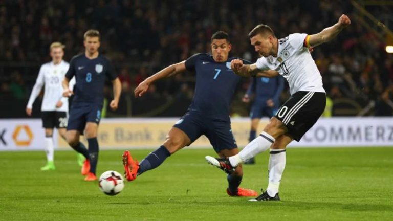 Lucas Podolski fires Germany ahead in a friendly match against England in Dortmund