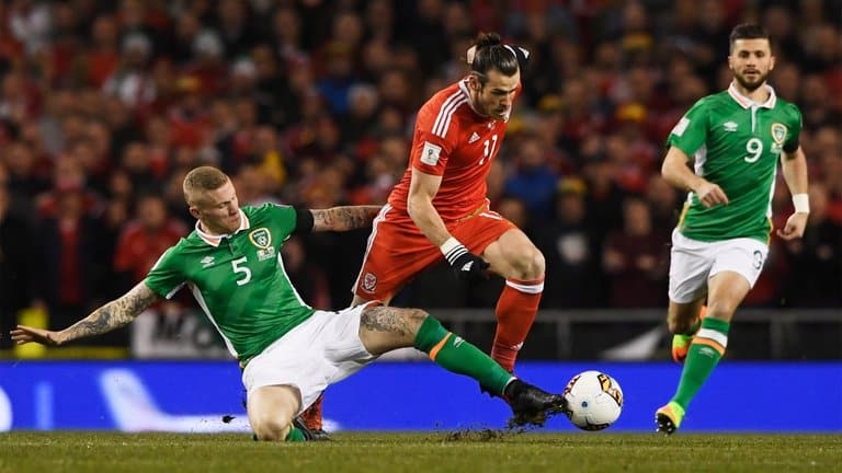 Wales' Gareth Bale battles for the ball in the World Cup qualification game against Ireland