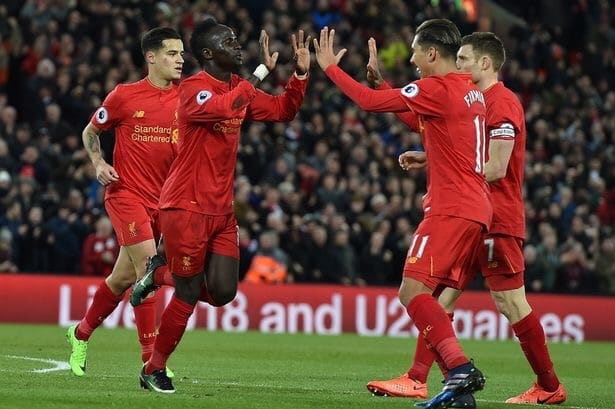 Sadio Mane celebrates scoring a goal for Liverpool against Arsenal with Roberto Firmino