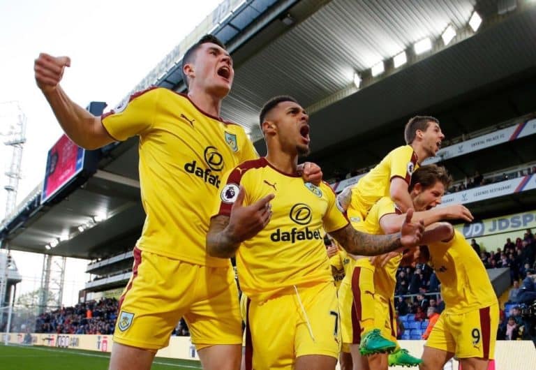 Andre Gray celebrates after scoring for Burnley