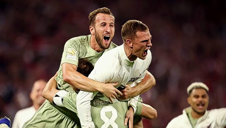 Harry Kane celebrates with Bayern Munich teammates Joshua Kimmich and Leom Goretzka.