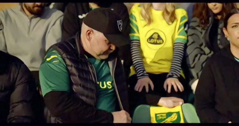 A Norwich City fan looks at an empty seat as part of the club's World Mental Health video.