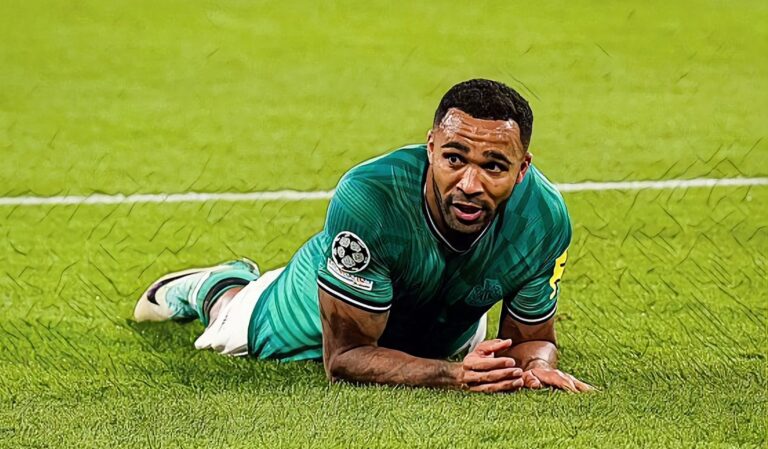 Callum Wilson of Newcastle United looks on while lying on the ground during the UEFA Champions League Group F match between Borussia Dortmund and Newcastle United FC at the Signal Iduna Park on November 7, 2023.