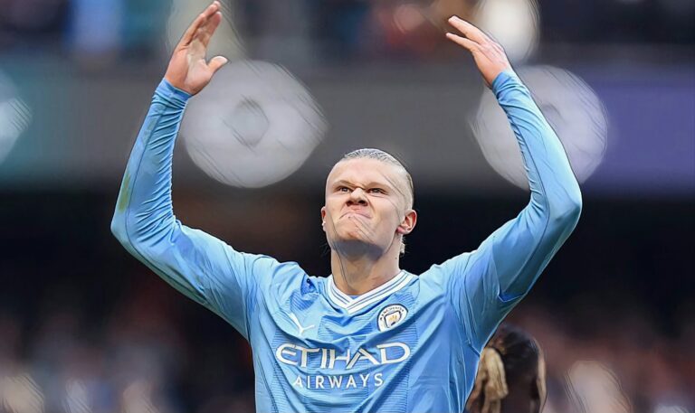 Erling Haaland of Manchester City celebrates after scoring his 50th goal in the Premier League during the match between Man City and Liverpool FC at Etihad Stadium on November 25, 2023.