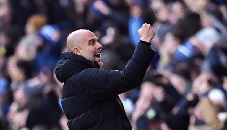 Pep Guardiola, Manager of Manchester City, celebrates after Erling Haaland (not pictured) scores the team's first goal during the Premier League match between Man City and Liverpool FC at Etihad Stadium on November 25, 2023.