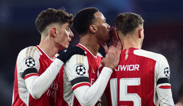 Gabriel Magalhaes of Arsenal whispers to Jakub Kiwior as Kai Havertz looks on during the UEFA Champions League match between Arsenal FC and RC Lens at Emirates Stadium on November 29, 2023.