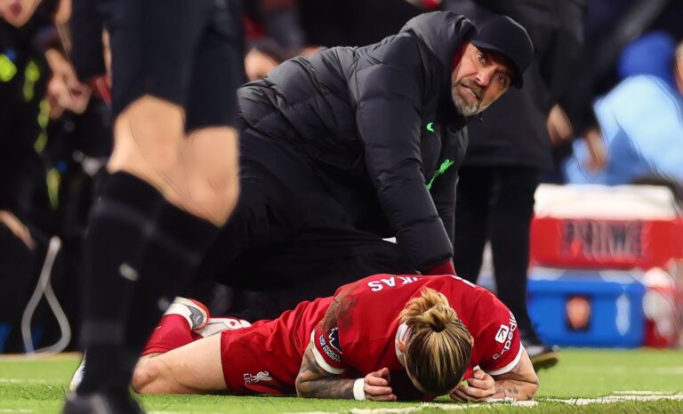 Liverpool Manager Jurgen Klopp & Konstantinos Tsimikas react during the Premier League match between Liverpool FC and Arsenal FC at Anfield on December 23, 2023