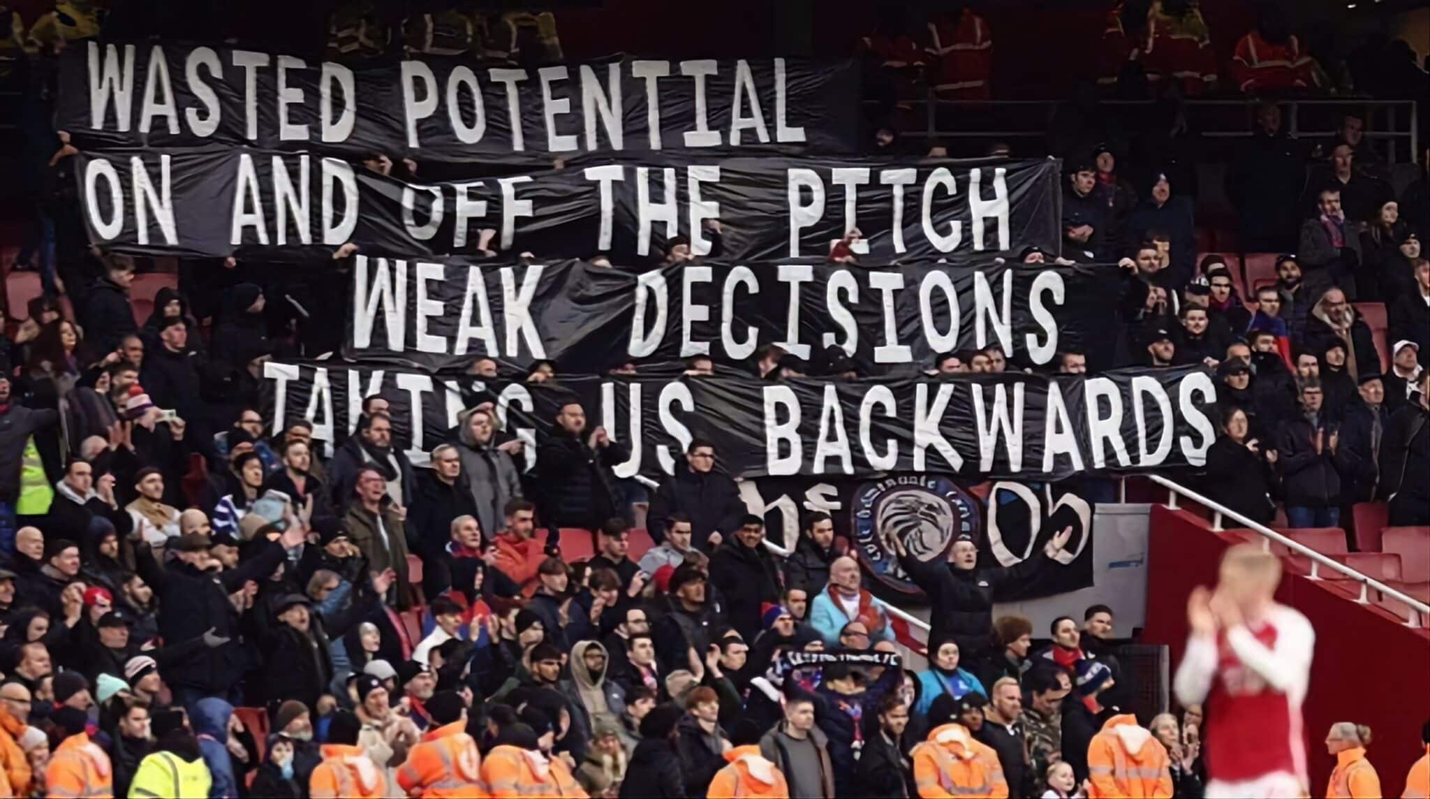 Crystal Palace fans hold up banners in response to their poor form during the Premier League match between Arsenal FC and Crystal Palace at Emirates Stadium on January 20, 2024 in London, England. (Photo by Jacques Feeney/Offside/Offside via Getty Images)