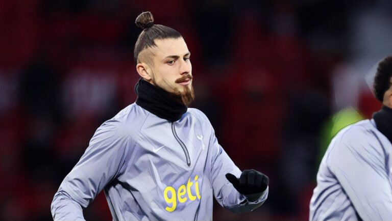 Radu Dragusin of Spurs warms up prior to the Premier League match between Manchester United and Tottenham Hotspur at Old Trafford on January 14, 2024 in Manchester, England. (Photo by Catherine Ivill/Getty Images)