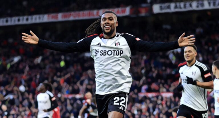 Alex Iwobi of Fulham celebrates after scoring their 2nd goal during the Premier League match between Man United and Fulham