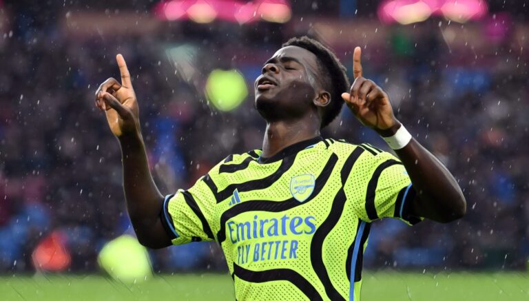 Bukayo Saka of Arsenal celebrates after scoring his team's third goal during the Premier League match between Burnley FC and Arsenal FC at Turf Moor on February 17, 2024 in Burnley, England. (Photo by Stuart MacFarlane/Arsenal FC via Getty Images)