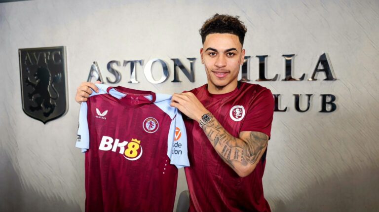 Morgan Rogers holds up an Aston Villa shirt after signing for the Premier League club from Middlesbrough on transfer deadline day.
