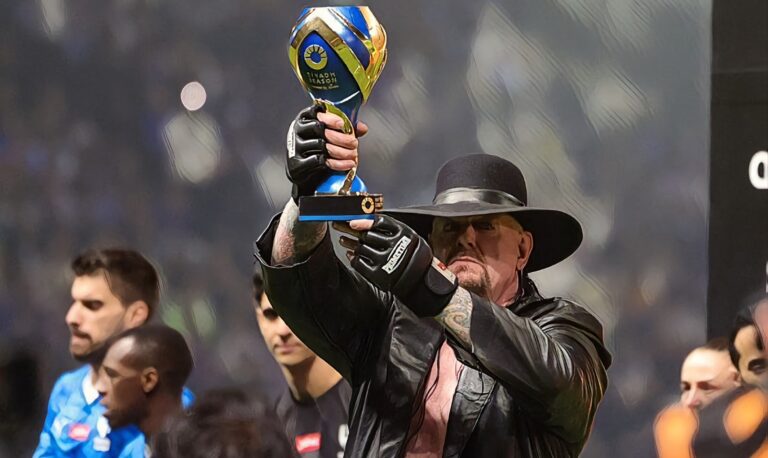 Former professional wrestler The Undertaker holds the Riyadh season trophy after the Riyadh Season Cup final match between Al-Nassr and Al-Hilal at the Kingdom Arena in Riyadh, on February 8, 2024. (Photo by Fayez Nureldine / AFP) (Photo by FAYEZ NURELDINE/AFP via Getty Images)