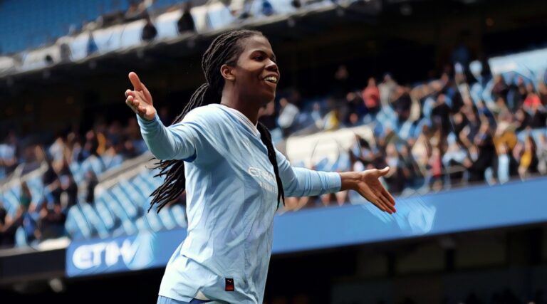 Khadija 'Bunny' Shaw of Man City celebrates scoring her team's third goal during the Barclays Women's Super League match between Manchester City and Manchester United at Etihad Stadium on March 23, 2024 in Manchester, England