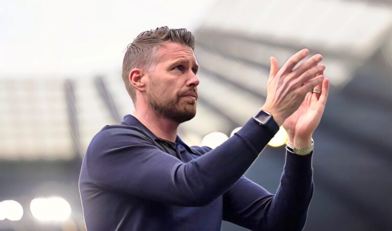 Rob Edwards, Manager of Luton Town, applauds the fans following the team's defeat during the Premier League match between Manchester City and Luton Town at Etihad Stadium on April 13, 2024 in Manchester, England.