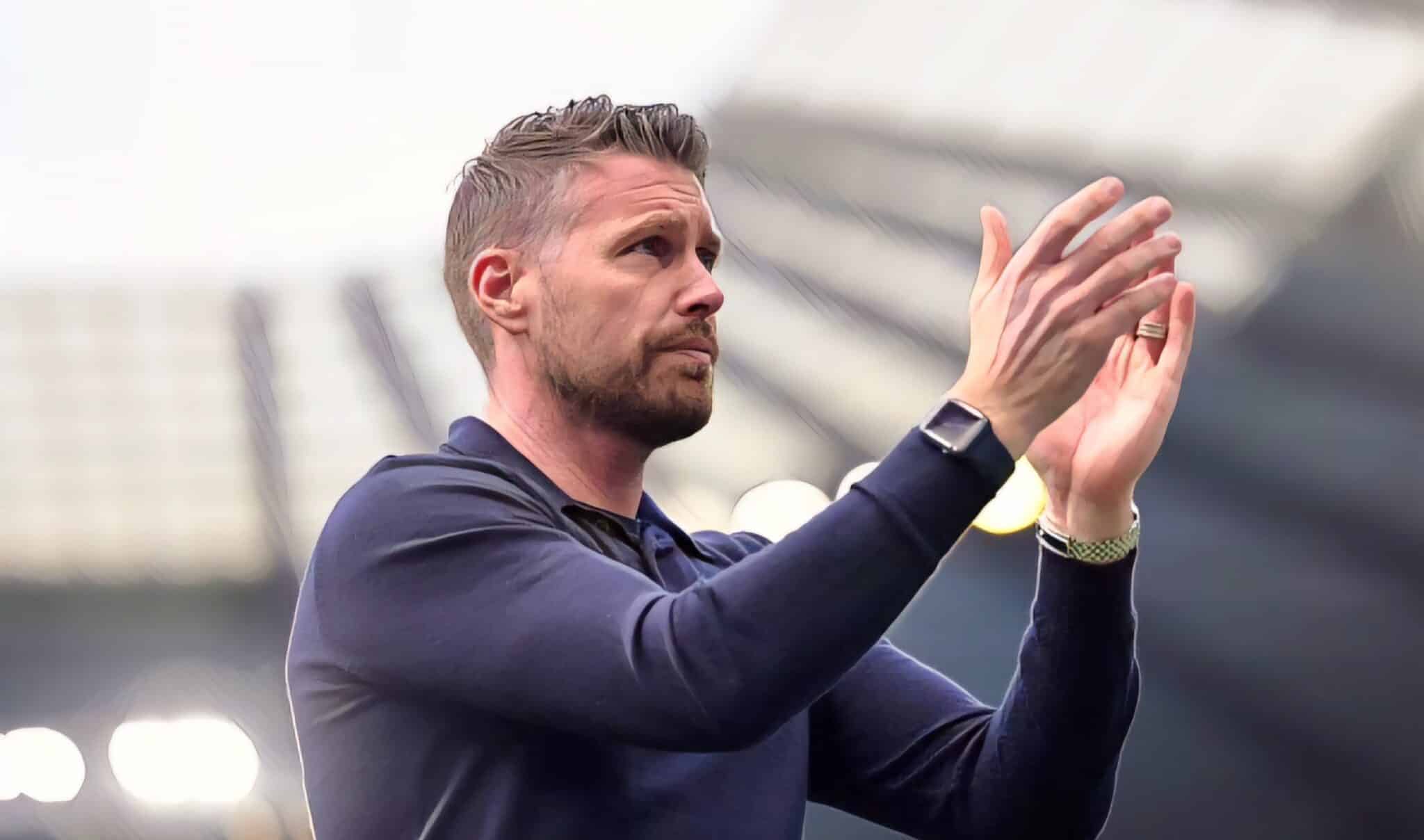 Rob Edwards, Manager of Luton Town, applauds the fans following the team's defeat during the Premier League match between Manchester City and Luton Town at Etihad Stadium on April 13, 2024 in Manchester, England.