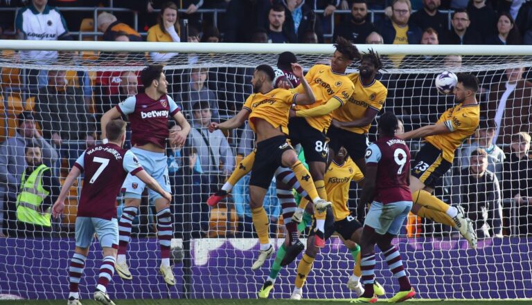 Max Kilman of Wolves scores a header which is later disallowed by VAR due to an offside against teammate Tawanda Chirewa during the Premier League match between Wolverhampton Wanderers and West Ham United at Molineux on April 6, 2024 in Wolverhampton, England.