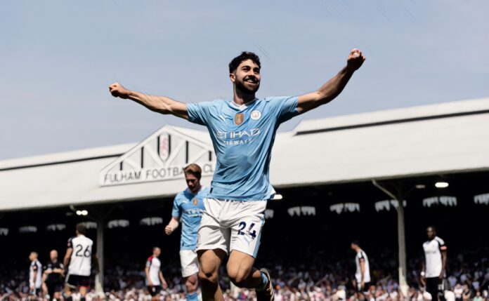 Josko Gvardiol of Manchester City celebrates after scoring his side's third goal during the Premier League match between Fulham FC and Manchester City at Craven Cottage on May 11, 2024 .