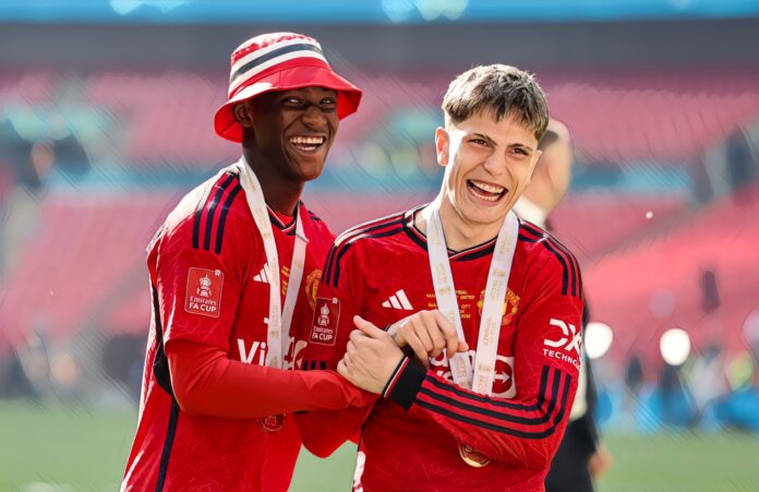 Goal-scorers Kobbie Mainoo and Alejandro Garnacho of Manchester United after their sides 2-1 win during the Emirates FA Cup Final match between Manchester City and Man Utd at Wembley Stadium on May 25, 2024