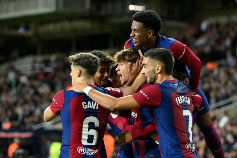 Barcelona's Spanish forward #38 Marc Guiu celebrates with teammates after scoring his team's first goal during the Spanish league football match between FC Barcelona and Athletic Club Bilbao at the Estadi Olimpic Lluis Companys in Barcelona on October 22, 2023.