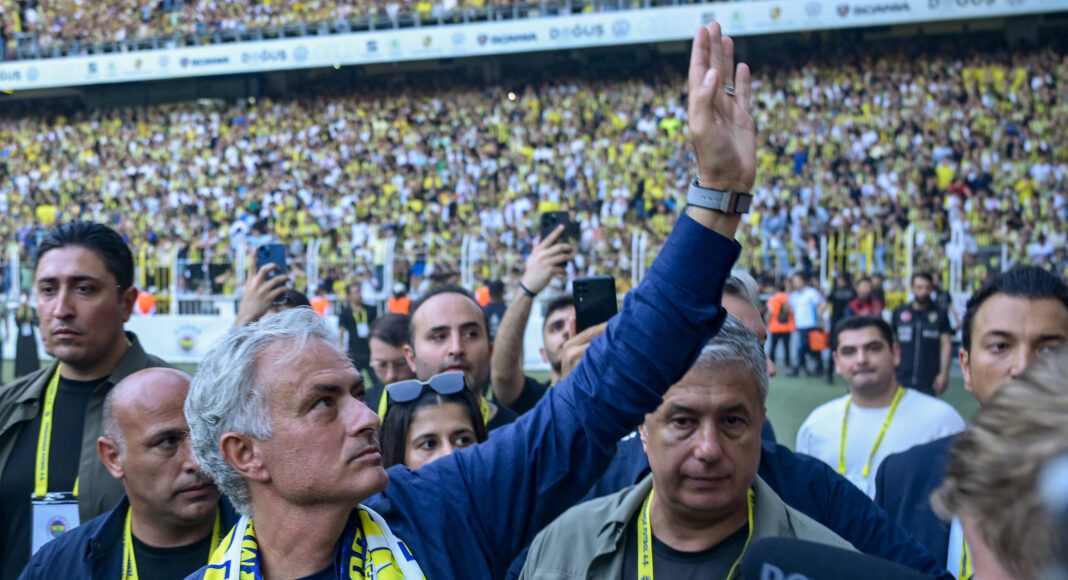 New coach of Turkish club Fenerbahce Jose Mourinho (C) waves during the presentation to the supporters at the Sukru Saracoglu Stadium in Istanbul on June 2, 2024. Two-time Champions League winning Jose Mourinho will be the new coach of Turkish club Fenerbahce, he announced on June 1. The Portuguese coach, who won the Champions League with Porto and Inter Milan, has not worked since he was sacked by Italian Serie A side Roma in January 2024.