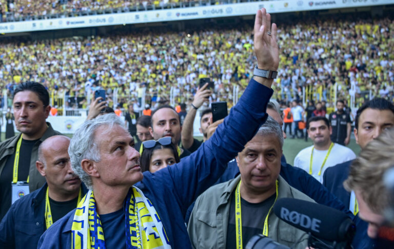 New coach of Turkish club Fenerbahce Jose Mourinho (C) waves during the presentation to the supporters at the Sukru Saracoglu Stadium in Istanbul on June 2, 2024. Two-time Champions League winning Jose Mourinho will be the new coach of Turkish club Fenerbahce, he announced on June 1. The Portuguese coach, who won the Champions League with Porto and Inter Milan, has not worked since he was sacked by Italian Serie A side Roma in January 2024.