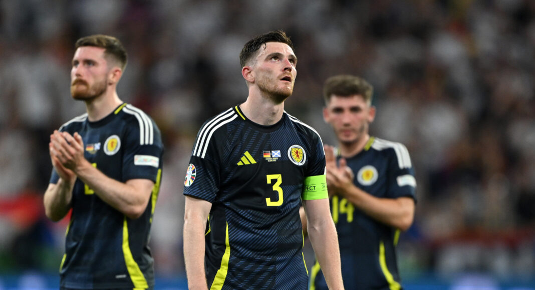 Andy Robertson of Scotland looks dejected at full-time following the team's defeat in the UEFA EURO 2024 group stage match between Germany and Scotland at Munich Football Arena on June 14, 2024 in Munich, Germany.