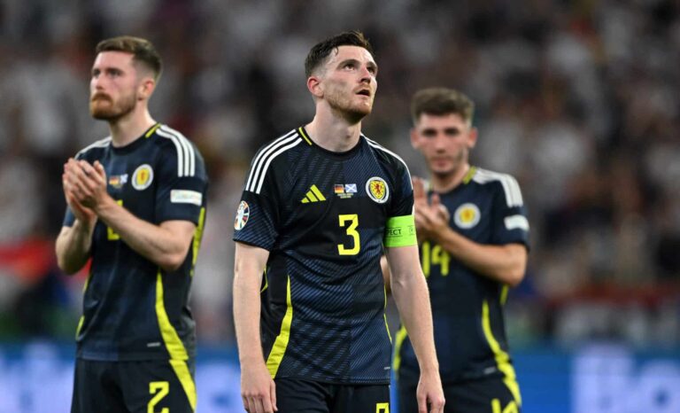 Andy Robertson of Scotland looks dejected at full-time following the team's defeat in the UEFA EURO 2024 group stage match between Germany and Scotland at Munich Football Arena on June 14, 2024 in Munich, Germany.