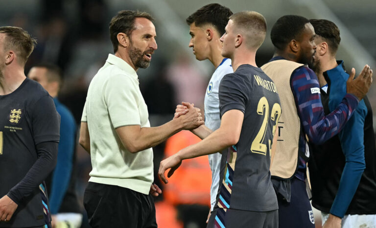 England's manager Gareth Southgate congratulates England's midfielder #23 Adam Wharton after the International friendly football match between England and Bosnia-Herzegovina at St James' Park in Newcastle-upon-Tyne, north east England on June 3, 2024. England won the match 3-0.