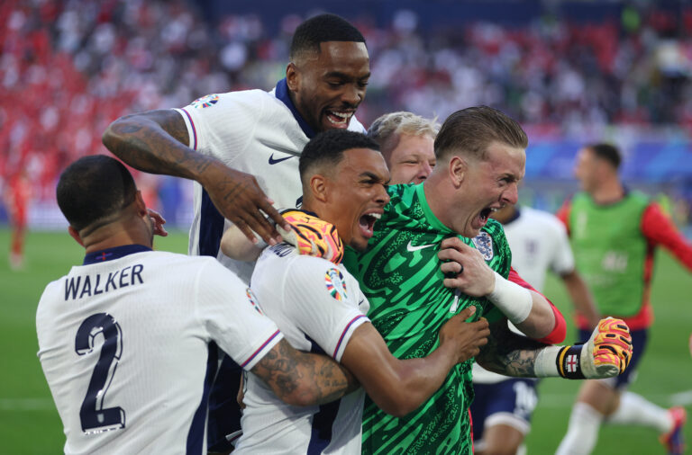 Trent Alexander-Arnold of England celebrates scoring the team's fifth and winning penalty in the penalty shoot out with teammates Kyle Walker, Ivan Toney and Jordan Pickford during the UEFA EURO 2024 quarter-final match between England and Switzerland at Düsseldorf Arena on July 06, 2024 in Dusseldorf, Germany.