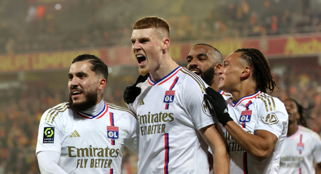 Lyon's Irish defender #12 Jake O'Brien (C) celebrates scoring his team's first goal during the French L1 football match between RC Lens and Olympique Lyonnais (Lyon) at Stade Bollaert-Delelis in Lens, northern France, on December 2, 2023.