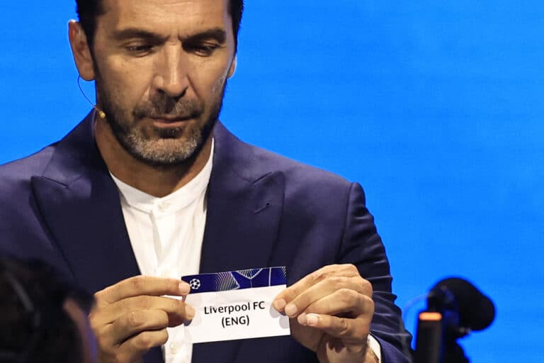 Italy's former goalkeeper Gianluigi Buffon shows the paper slip of Liverpool (ENG) during the group stage of the 2024-2025 UEFA Champions League football tournament, at the Grimaldi Forum in Monaco on August 29, 2024.