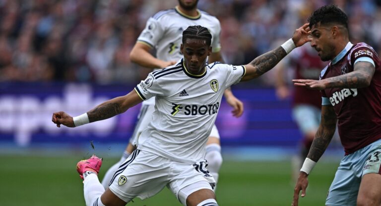 West Ham United's Italian defender Emerson Palmieri (R) blocks a shot by Leeds United's Dutch striker Crysencio Summerville during the English Premier League football match between West Ham United and Leeds United at the London Stadium, in London on May 21, 2023.