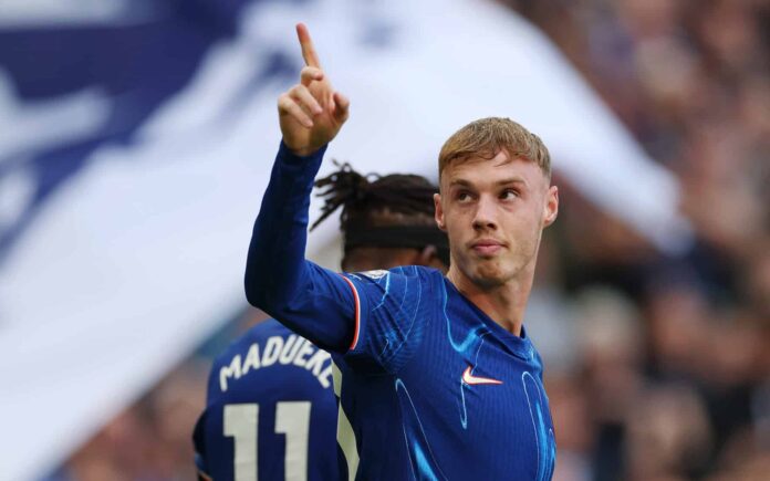 Cole Palmer of Chelsea celebrates scoring his team's third goal and his hat trick during the Premier League match between Chelsea FC and Brighton & Hove Albion FC at Stamford Bridge on September 28, 2024 in London, England.