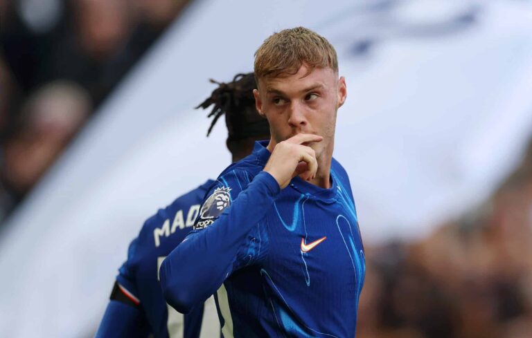 Cole Palmer of Chelsea celebrates scoring his team's third goal and his hat trick during the Premier League match between Chelsea FC and Brighton and Hove Albion FC at Stamford Bridge on September 28, 2024 in London, England.