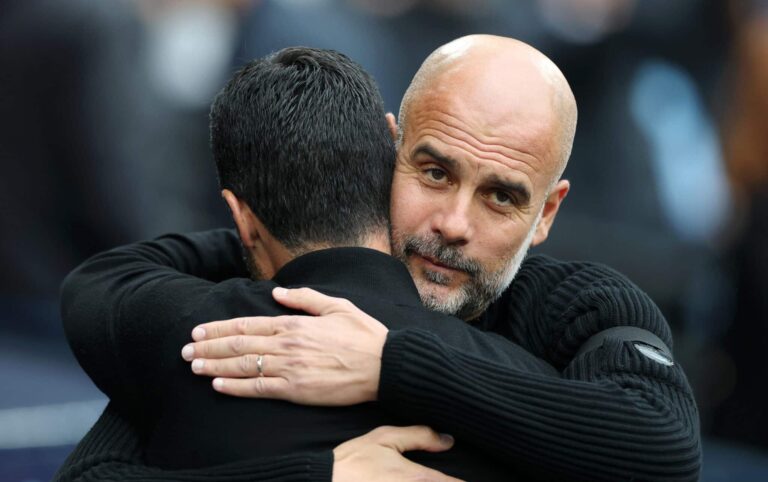 Mikel Arteta, Manager of Arsenal, embraces Pep Guardiola, Manager of Man City, prior to the Premier League match between Manchester City FC and Arsenal FC at Etihad Stadium on September 22, 2024 in Manchester, England.