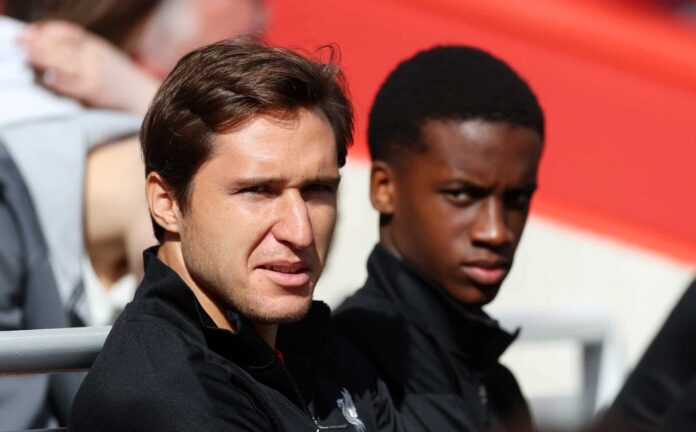 Federico Chiesa of Liverpool looks on from the bench during the Premier League match between Liverpool FC and Nottingham Forest FC at Anfield on September 14, 2024 in Liverpool, England.