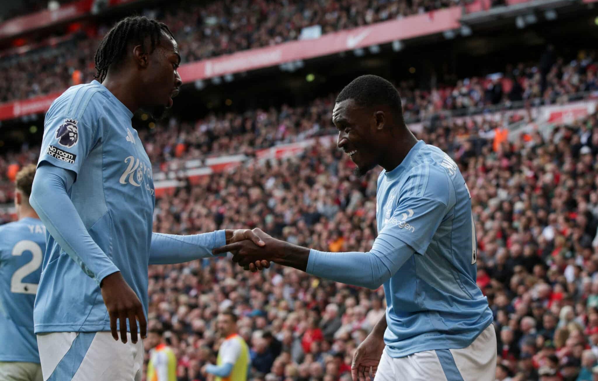 Nottingham Forest's English midfielder #14 Callum Hudson-Odoi (R) celebrates after scoring his team first goal during the English Premier League football match between Liverpool and Nottingham Forest at Anfield in Liverpool, north west England on September 14, 2024.
