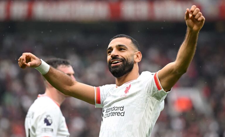 Mo Salah of Liverpool celebrates scoring his team's third goal during the Premier League match between Man United FC and Liverpool FC at Old Trafford on September 01, 2024 in Manchester, England.
