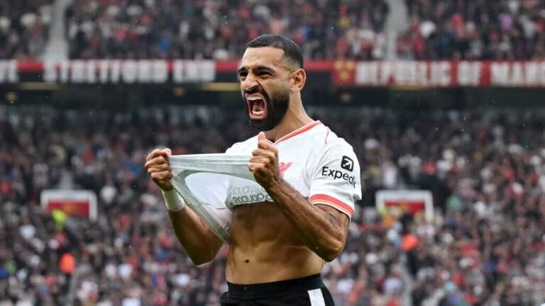 Liverpool forward Mo Salah celebrates scoring a goal against Manchester United in the Premier League.