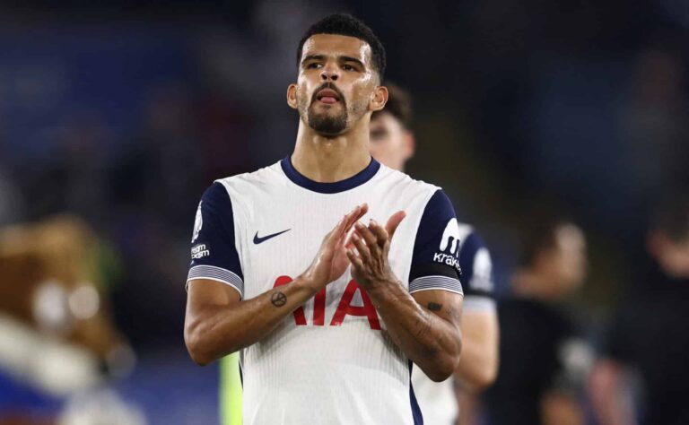 Tottenham Hotspur's English striker #19 Dominic Solanke applauds fans on the pitch after the English Premier League football match between Leicester City and Spurs at King Power Stadium in Leicester, central England on August 19, 2024. The game finished 1-1.