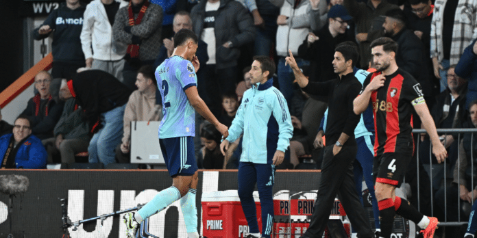 Arsenal defender William Saliba and manager Mikel Arteta.