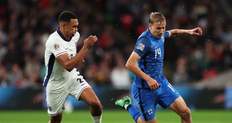 Topi Keskinen of Finland runs with the ball under pressure from Trent Alexander-Arnold of England during the UEFA Nations League 2024/25 League B Group B2 match between England and Finland at Wembley Stadium on September 10, 2024 in London, England.