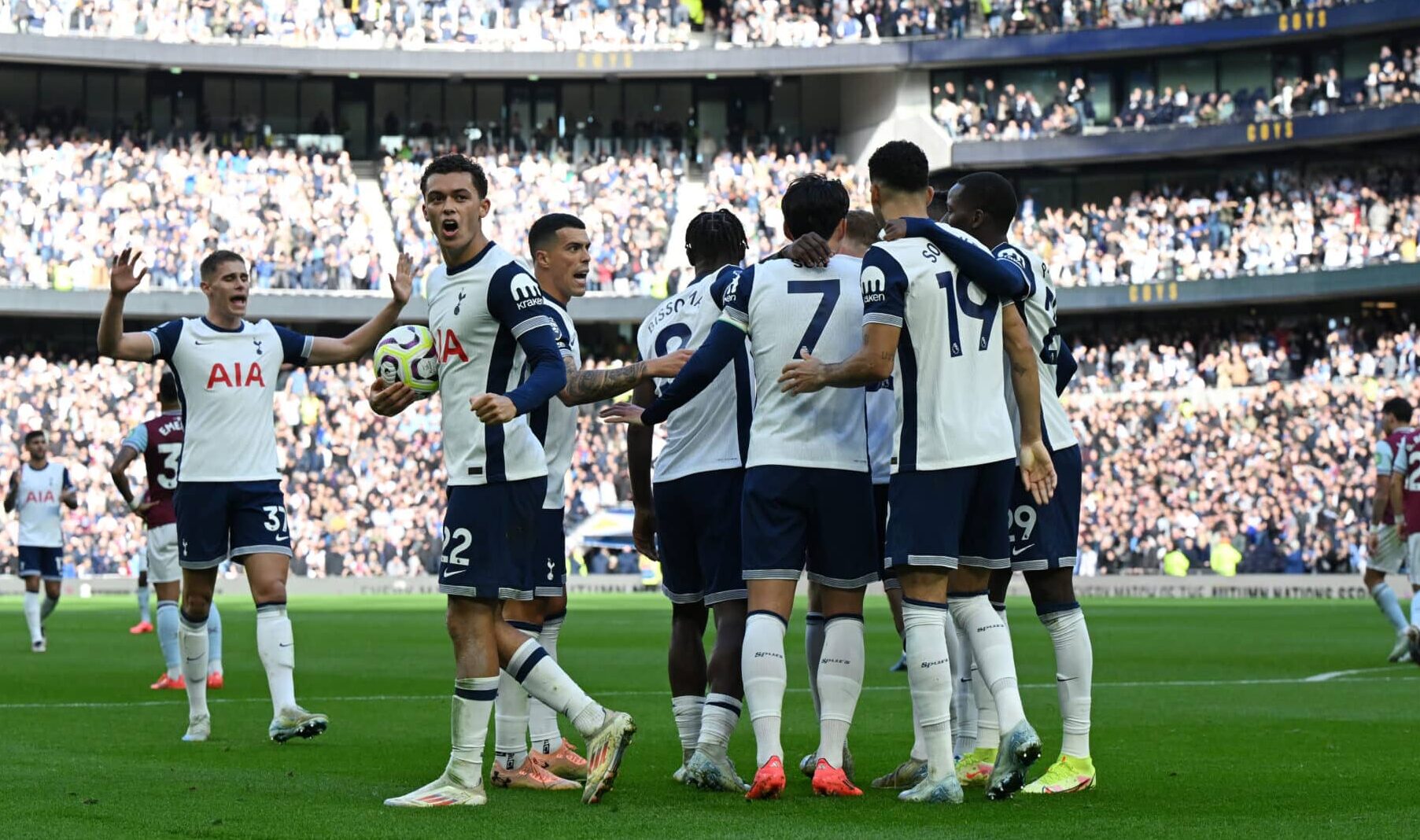 Spurs players celebrate their team's third goal, an own goal scored by Jean-Clair Todibo of West Ham United (not pictured) during the Premier League match between Tottenham Hotspur FC and West Ham United FC at Tottenham Hotspur Stadium on October 19, 2024 in London, England.