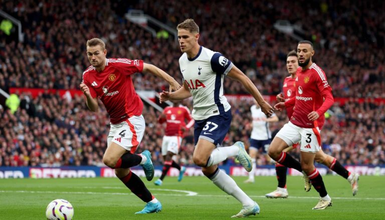 Tottenham Hotspur's Micky van de Ven sets up their first goal during the Premier League match between Man United FC and Spurs at Old Trafford on September 29, 2024 in Manchester, England.