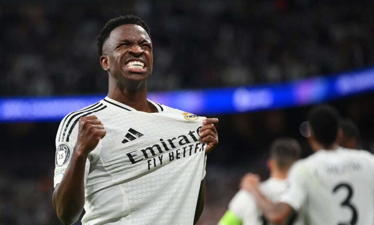 Vinicius Junior of Real Madrid celebrates scoring his team's fifth goal during the UEFA Champions League 2024/25 League Phase MD3 match between Real Madrid C.F. and Borussia Dortmund at Estadio Santiago Bernabeu on October 22, 2024 in Madrid, Spain.