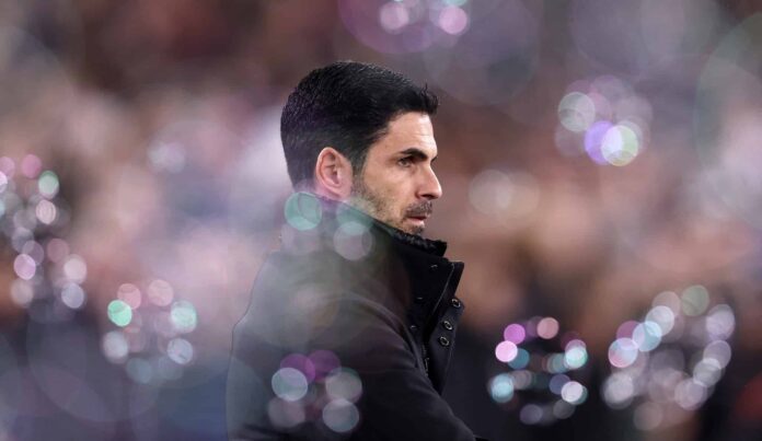 Mikel Arteta, Manager of Arsenal, looks on prior to the Premier League match between West Ham United FC and Arsenal FC at London Stadium on November 30, 2024 in London, England.