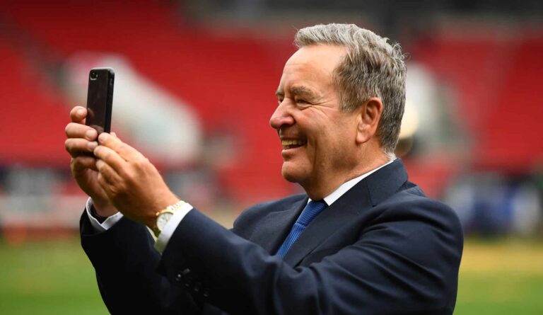 Presenter Jeff Stelling interacts with their mobile phone following the Vanarama National League Play-Off Final match between Hartlepool United and Torquay United at Ashton Gate on June 20, 2021 in Bristol, England.